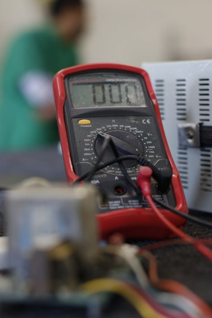 pexels photo 11679114 Close-up shot of a multimeter used for electrical measurements, with focus on the display.